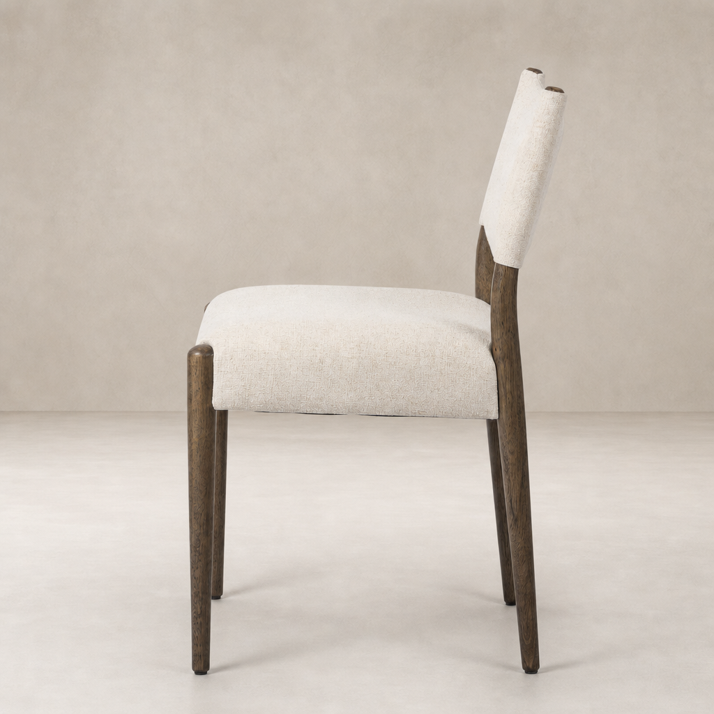 Mira Armless Dining Chair in Antwerp Natural with textured fabric and dark wood legs.