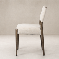 Mira Armless Dining Chair in Antwerp Natural with textured fabric and dark wood legs.
