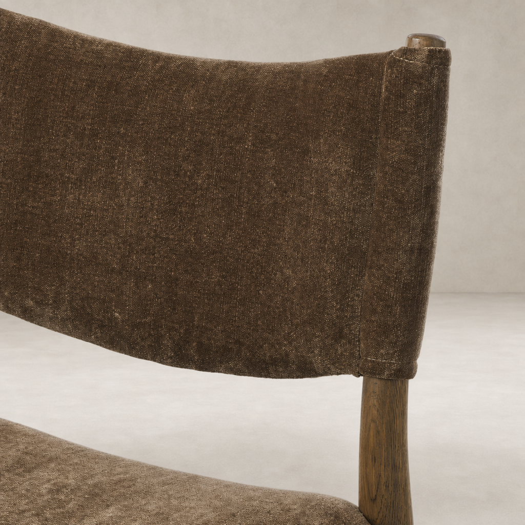 Mira Armless Dining Chair in Altair Mushroom showcasing soft, textured upholstery and wooden legs.