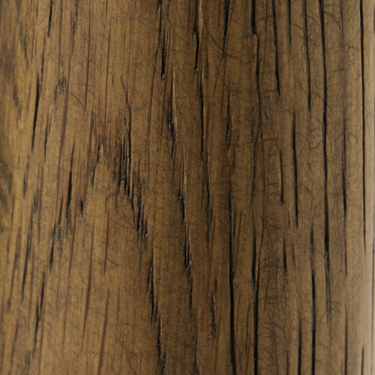Close-up of the textured wood finish on the Mira Armless Dining Chair in Altair Mushroom.