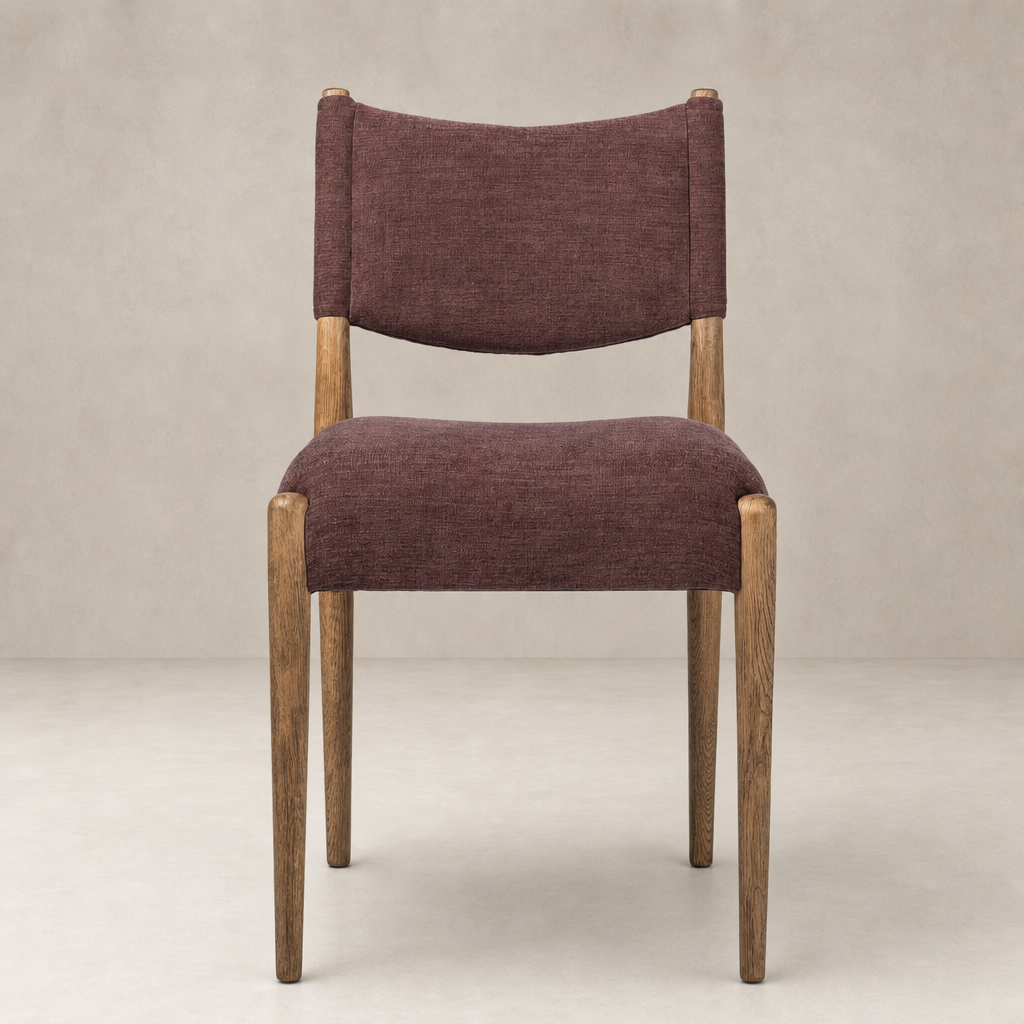 Mira Armless Dining Chair in Laughlin Plum with wood legs and a curved back design.