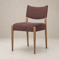 Mira Armless Dining Chair in Laughlin Plum with wooden legs and textured upholstery.