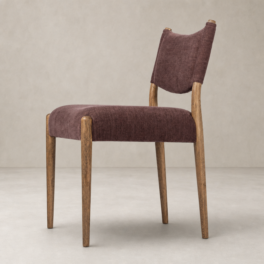 Mira Armless Dining Chair in Laughlin Plum with wooden legs and textured fabric upholstery.