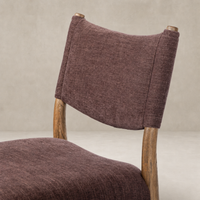 Mira Armless Dining Chair in Laughlin Plum with textured fabric and natural wood frame.