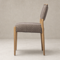 Mira Armless Dining Chair in Saxon Mink with a sleek profile and wooden legs.