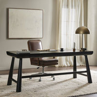 Koa Desk in worn black acacia with a sleek, modern design and sturdy legs.