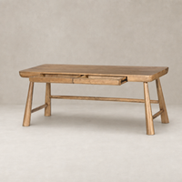 Koa Desk in caramel rubberwood featuring a minimalist design and two spacious drawers.