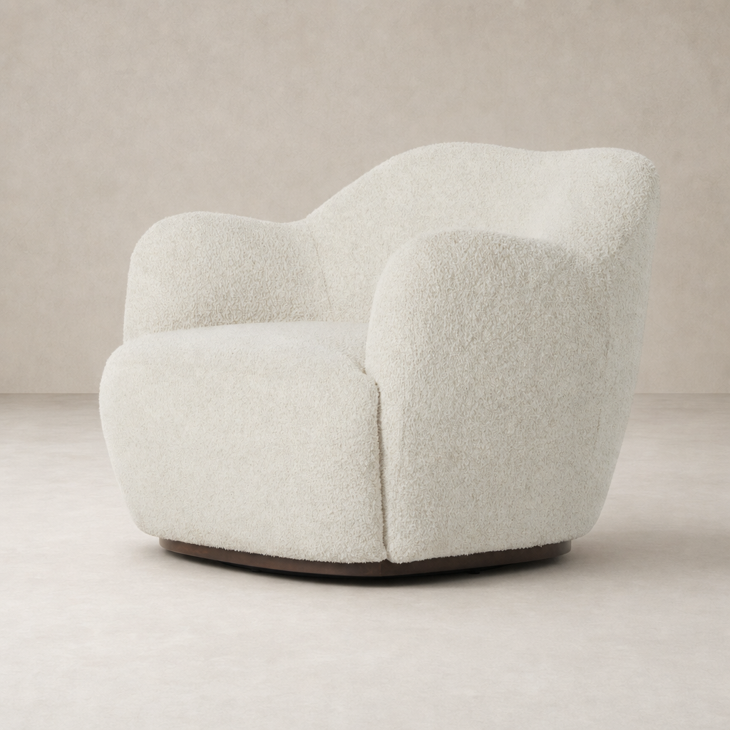Poppy Swivel Chair in Sheldon Ivory with a rounded shape and soft textured fabric.