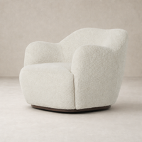 Poppy Swivel Chair in Sheldon Ivory with a rounded shape and soft textured fabric.