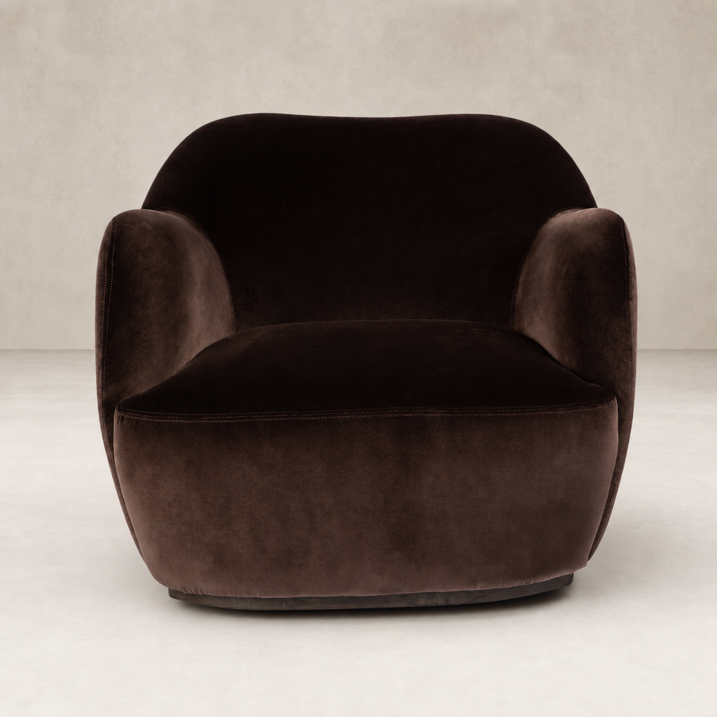 Poppy Swivel Chair in Surrey Cocoa features a plush, rounded design with soft upholstery.