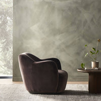 Poppy Swivel Chair in Surrey Cocoa featuring a sleek, plush design against a soft background.