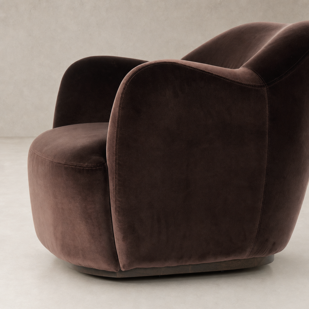 Poppy Swivel Chair in Surrey Cocoa featuring a sleek, modern design and plush upholstery.