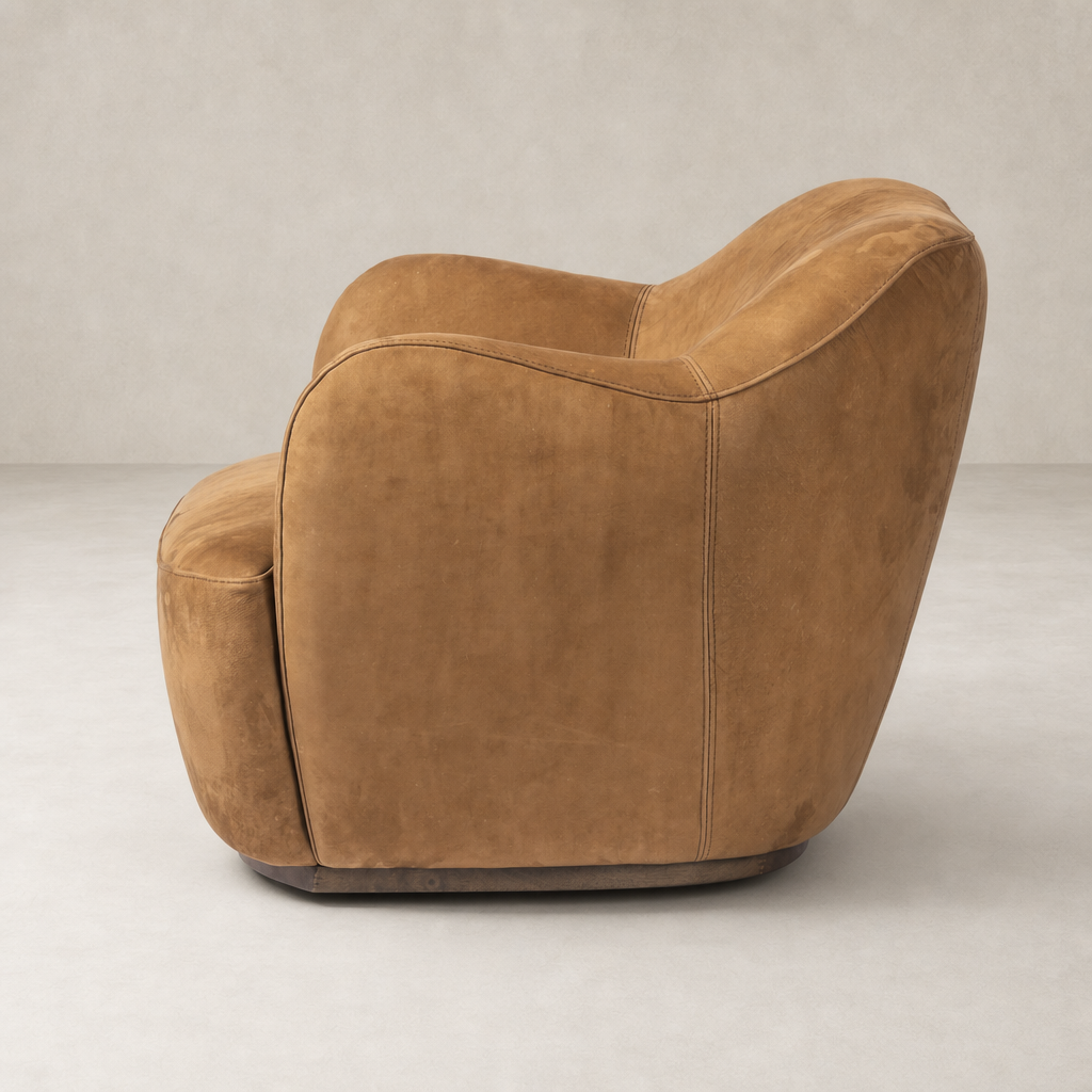 Poppy Swivel Chair in soft Nubuck Cognac with rounded edges and plush upholstery.