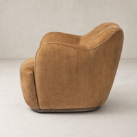 Poppy Swivel Chair in soft Nubuck Cognac with rounded edges and plush upholstery.