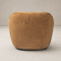 Poppy Swivel Chair in soft nubuck cognac with rounded back and elegant stitching.