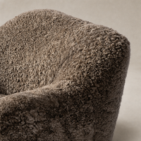 Taupe shearling texture of the Poppy Swivel Chair showcasing its cozy, plush design.