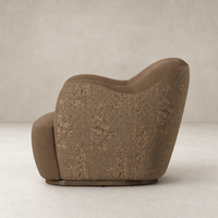 Poppy Swivel Chair in Fallingbrook Cafe, featuring a curved, cozy shape and textured finish.