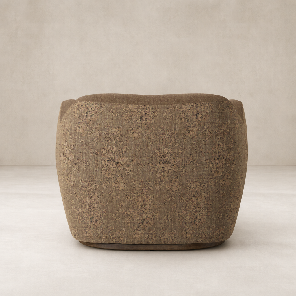 Poppy Swivel Chair in Fallingbrook Cafe with textured floral upholstery and rounded shape.