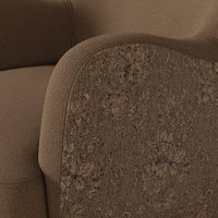 Close-up of the Poppy Swivel Chair in Fallingbrook Cafe showcasing textured fabric and floral patterns.