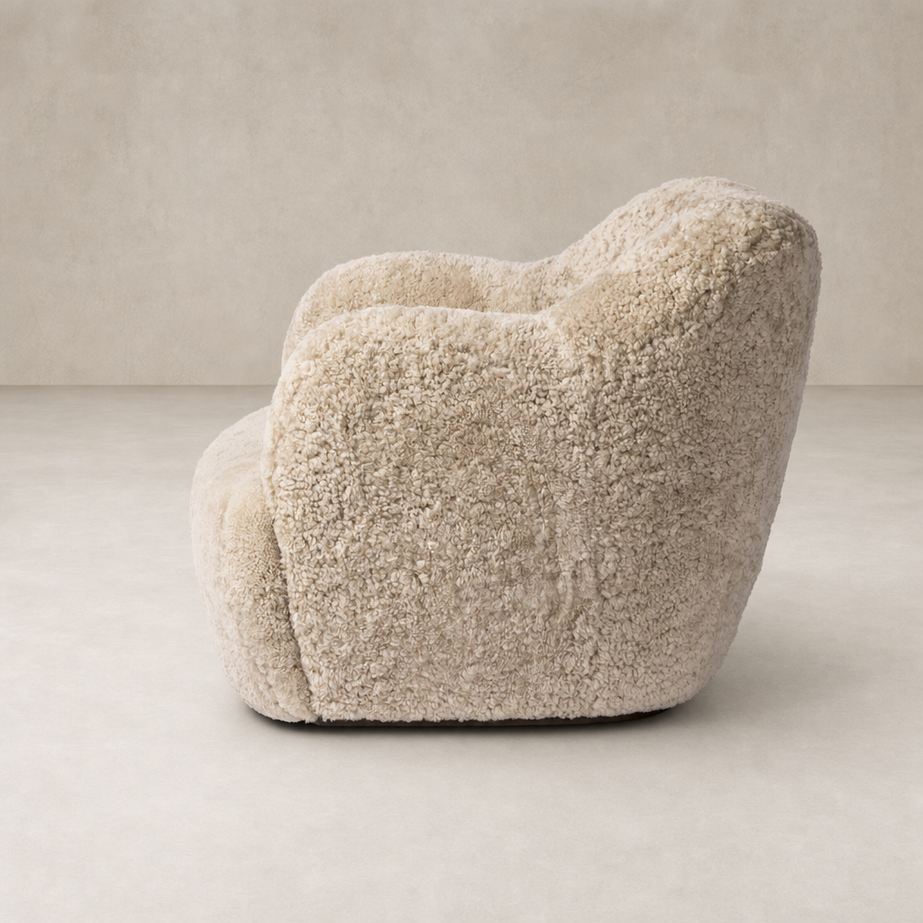Beige shearling Poppy Swivel Chair with soft, rounded curves and plush texture.