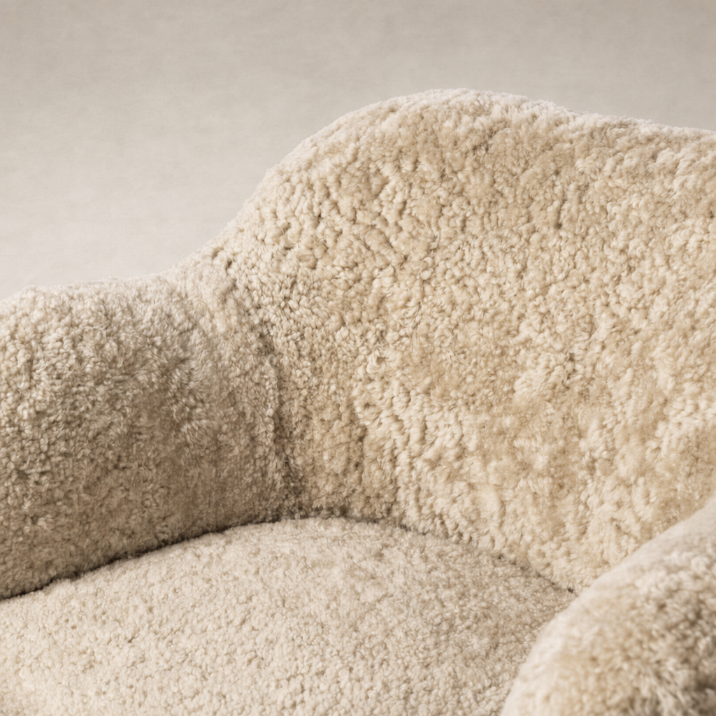 Close-up of the Poppy Swivel Chair in beige shearling showcasing its plush texture and cozy design.