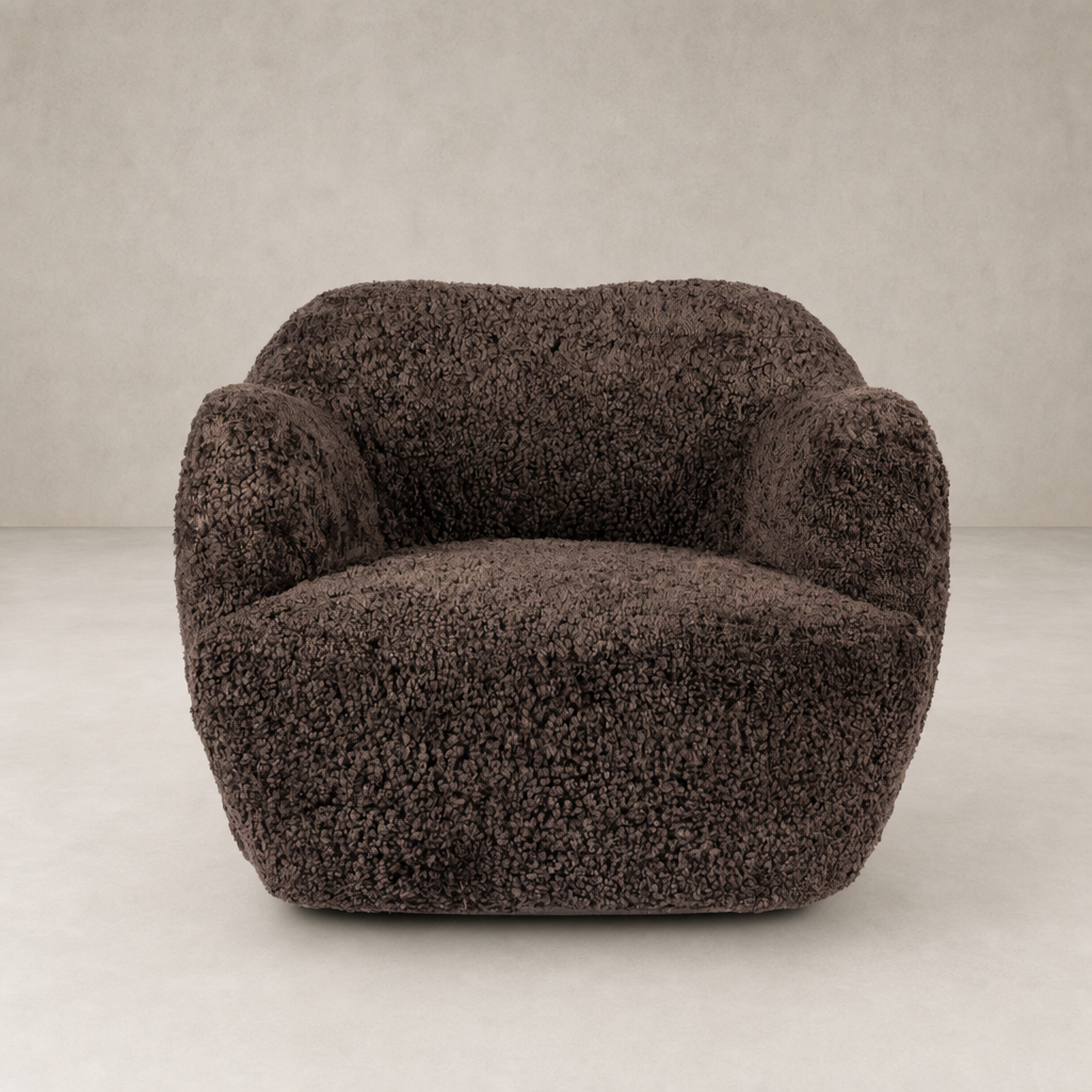 Poppy Swivel Chair in cocoa shearling with soft, rounded shape and plush texture.