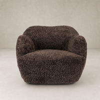 Poppy Swivel Chair in cocoa shearling with soft, rounded shape and plush texture.