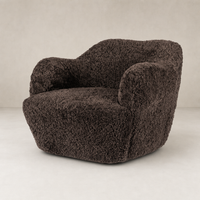 Cocoa shearling Poppy Swivel Chair with soft, textured upholstery and rounded arms.