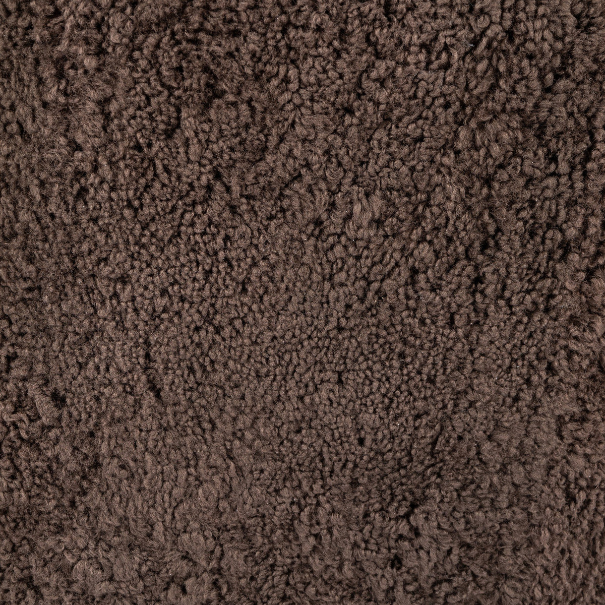 Cocoa shearling texture of the Poppy Swivel Chair close-up showing soft, plush fabric.