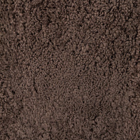 Cocoa shearling texture of the Poppy Swivel Chair close-up showing soft, plush fabric.