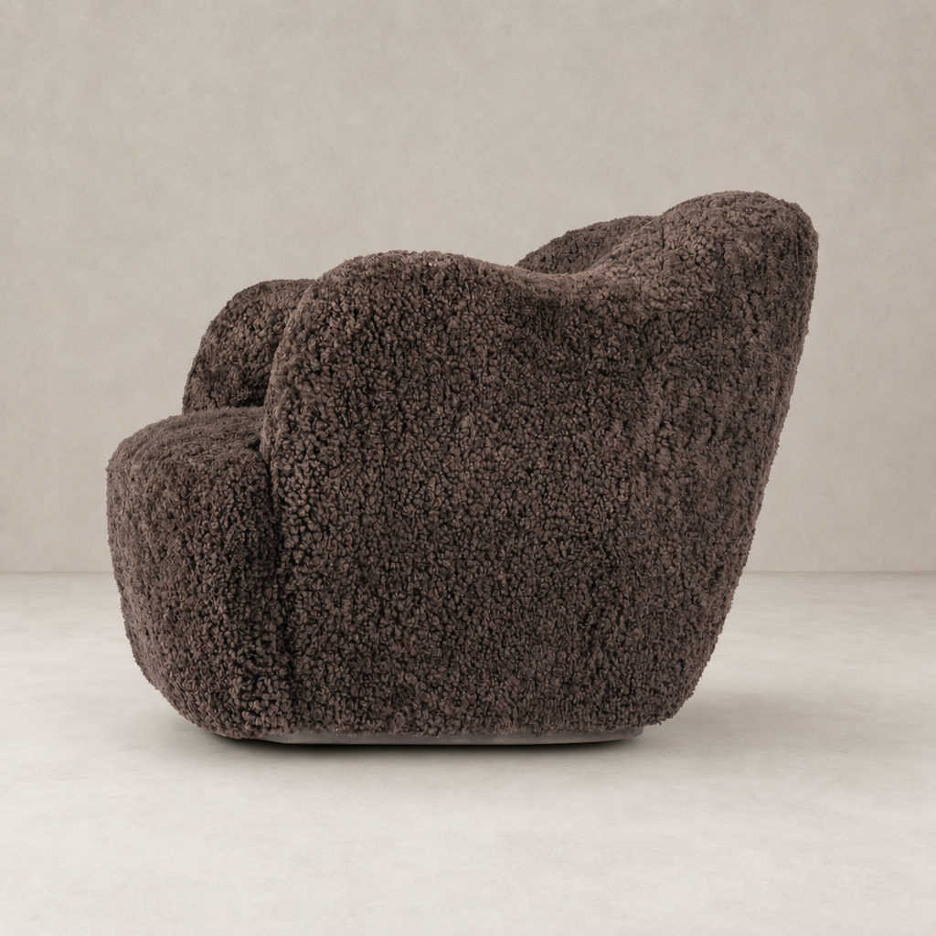 Poppy Swivel Chair in cocoa shearling featuring a cozy, rounded design for optimal comfort.