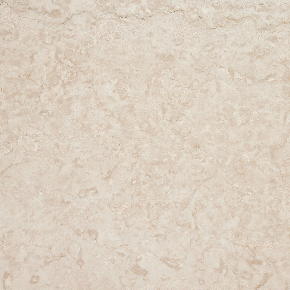 Close-up of the outdoor cream marble surface of the Ashland Outdoor Rectangular Coffee Table.