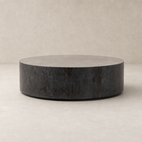 Milo Coffee Table in bluestone featuring a sleek, round design with textured finish.