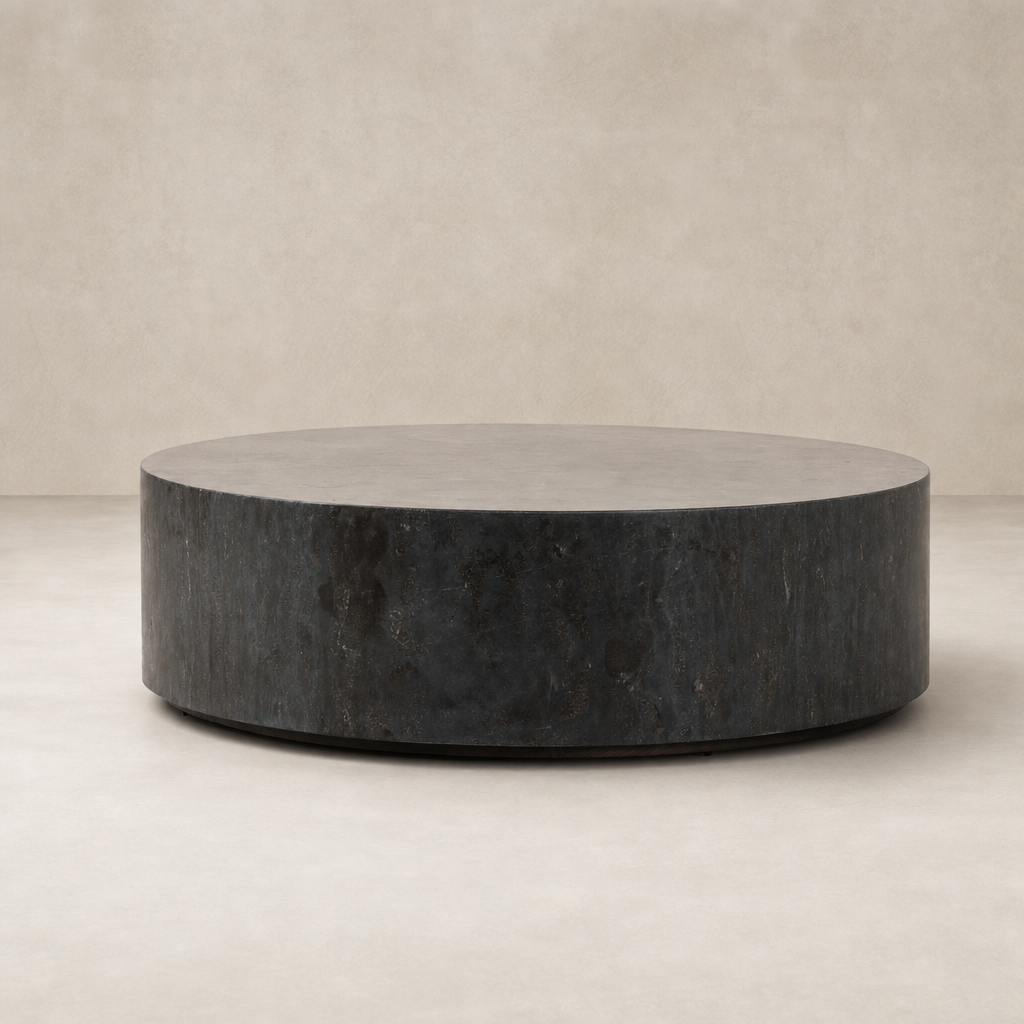 Milo Coffee Table in bluestone with a sleek, round silhouette and textured finish.