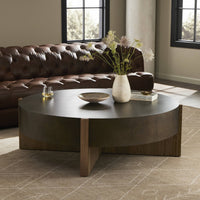 Ashby Large Coffee Table in distressed iron with round shape and wood accents.