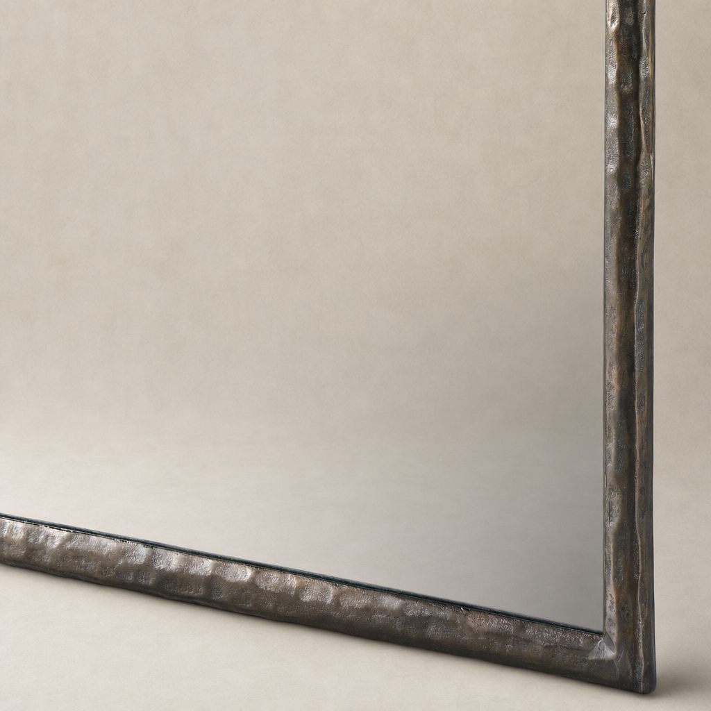 Bexley Wall Mirror with a textured Smoked Nickel frame in a studio setting.