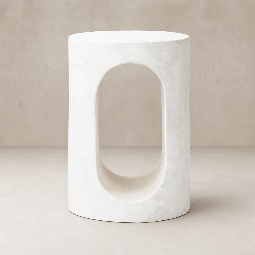 Atlas End Table with a circular top and sculptural cutout design in white finish.