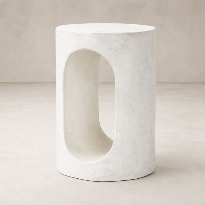 Atlas End Table features a unique oval cutout design and a smooth, minimalist white finish.