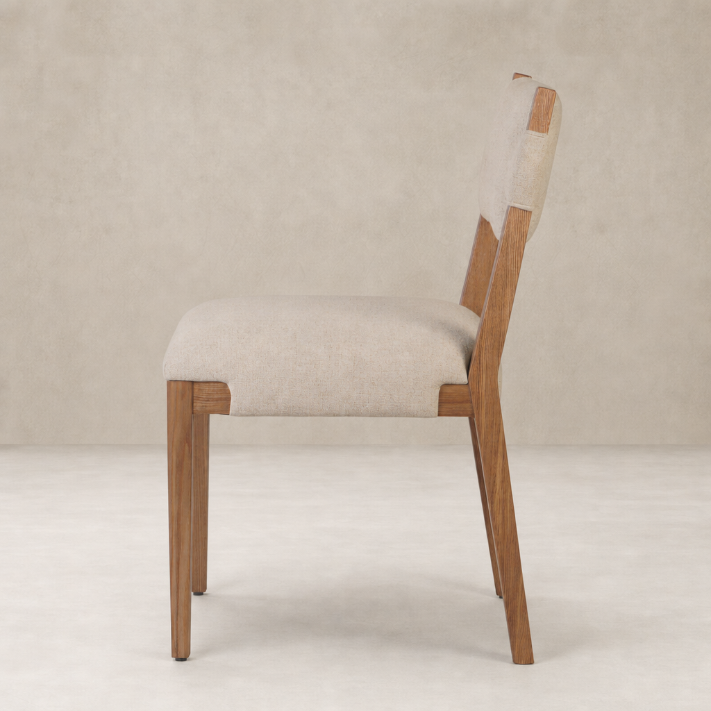 Nori Dining Chair in Antwerp Natural, featuring a sleek profile and wooden legs.