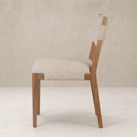 Nori Dining Chair in Antwerp Natural, featuring a sleek profile and wooden legs.