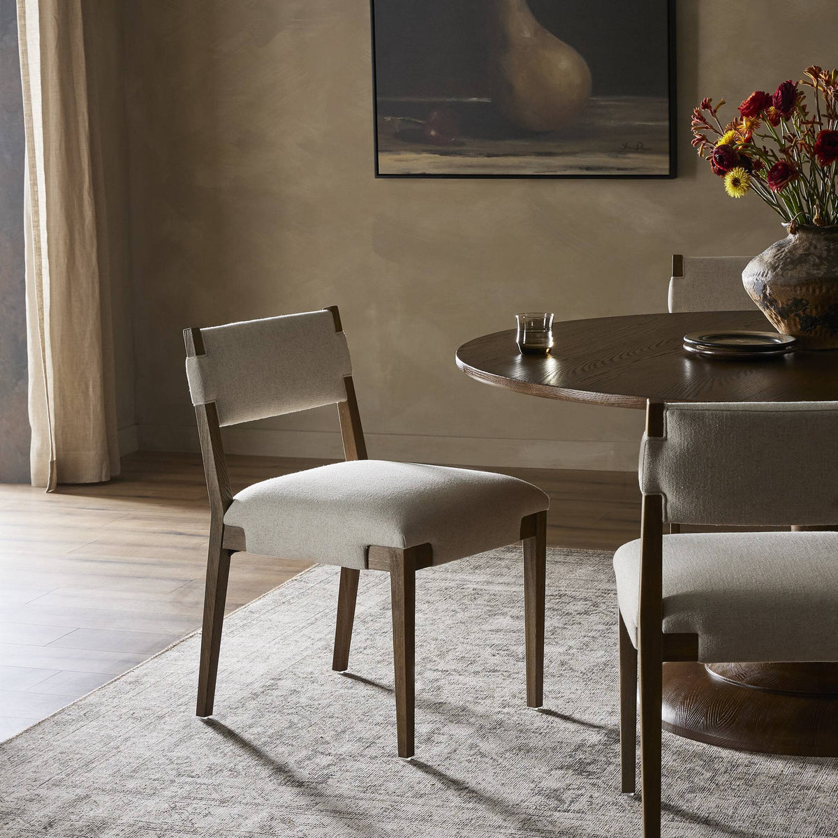 Nori Dining Chair in Antwerp Natural featuring an elegant design and soft upholstery.