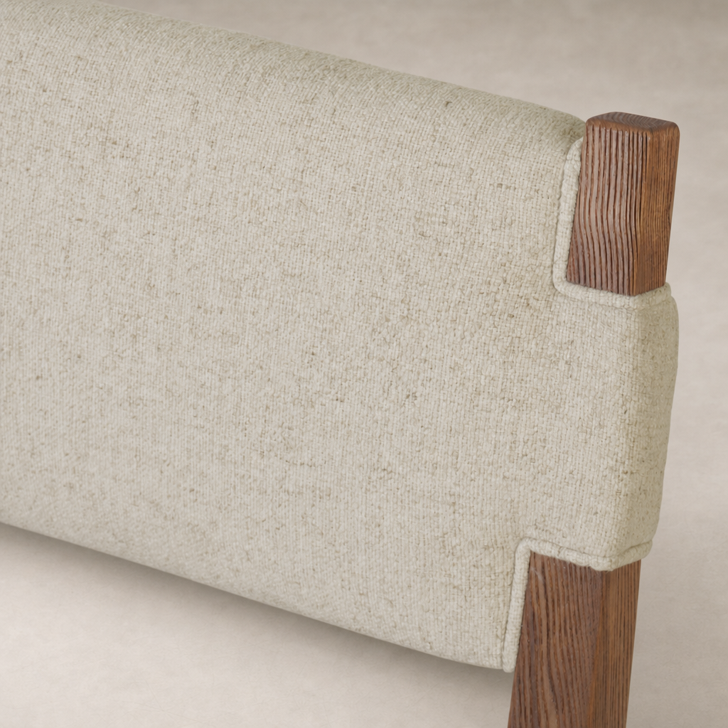 Nori Dining Chair with Antwerp Natural fabric showcasing its textured upholstery and wood accents.