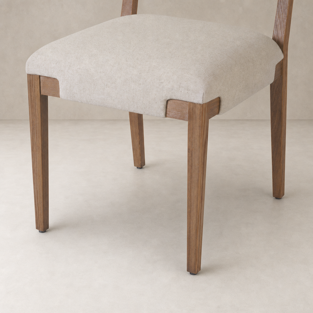 Nori Dining Chair in Antwerp Natural featuring a soft cushioned seat and sturdy wooden legs.