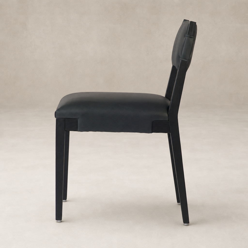 Sleek Nori Dining Chair in Brickhouse Black with a modern design and smooth upholstery.