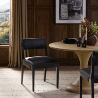 Nori Dining Chair in Brickhouse Black featuring a sleek design, set against a stylish dining area.