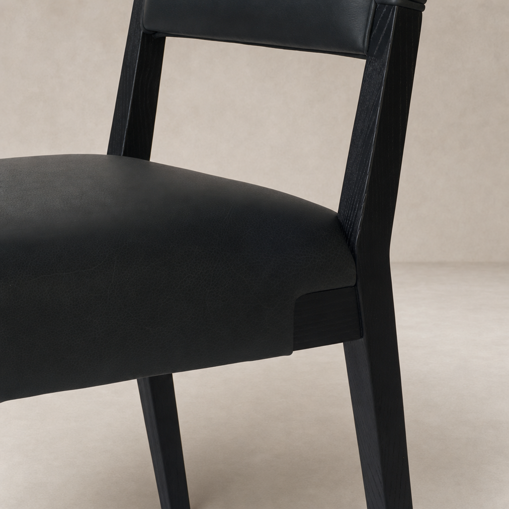 Nori Dining Chair in Brickhouse Black with a sleek design and textured finish.