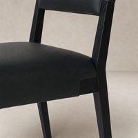 Nori Dining Chair in Brickhouse Black with a sleek design and textured finish.