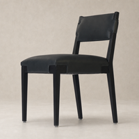 Stylish Nori Dining Chair in Brickhouse Black with sleek lines and sturdy wooden legs.