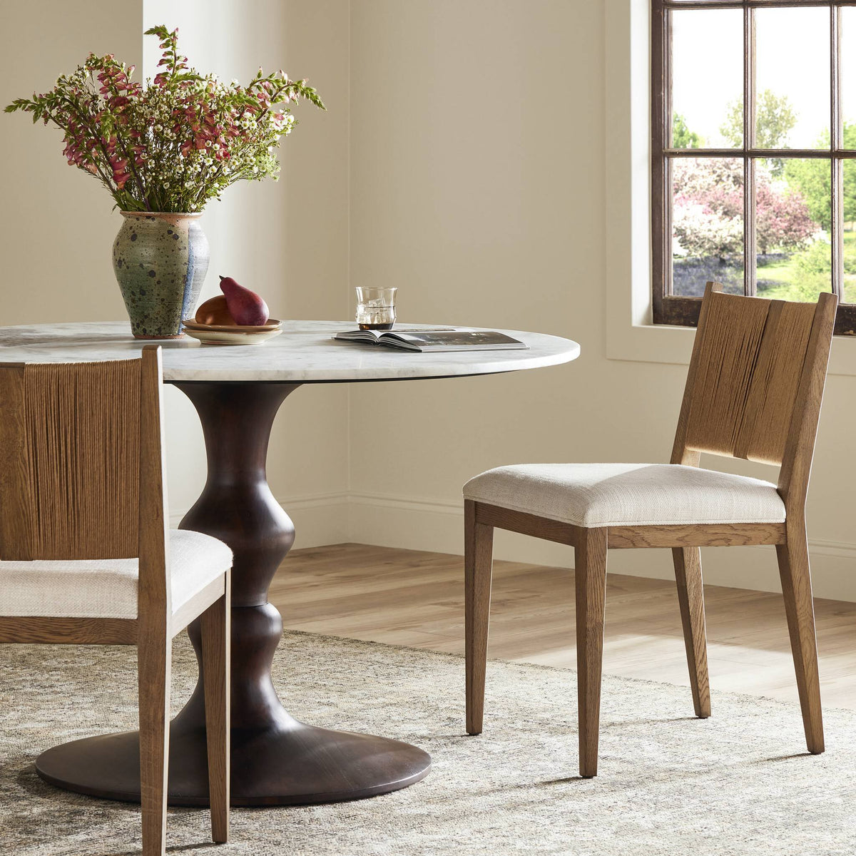 Celeste Dining Chair in Dover Crescent with a minimalist wood frame and soft fabric seat.