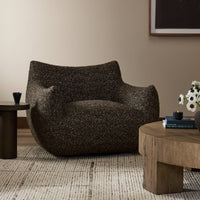 Side view of the Ciel Swivel Chair in textured brown fabric, complementing a modern living space.
